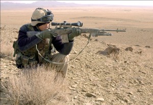 Photo by Staff Sgt. Bradley Rhen Spc. Jonathan Low, a designated marksman for Co. C, 2nd Bn., 27th Inf. Rgt., uses the scope on his M14 rifle to check out a man approaching in the distance Dec. 22 from a hilltop in Khoday Nazar Kor, Afghanistan.